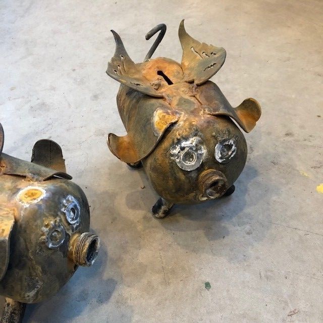 Piggy bank with wings made from a Colman propane tank recycled scrap art bank
