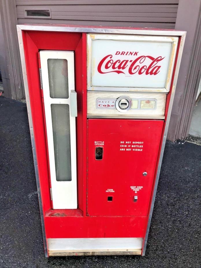 Original vintage Coca Cola bottled vending machine.