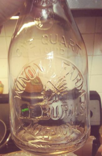 Winona Farms Natick Mass. embossed quart milk bottle with Chief in headdress