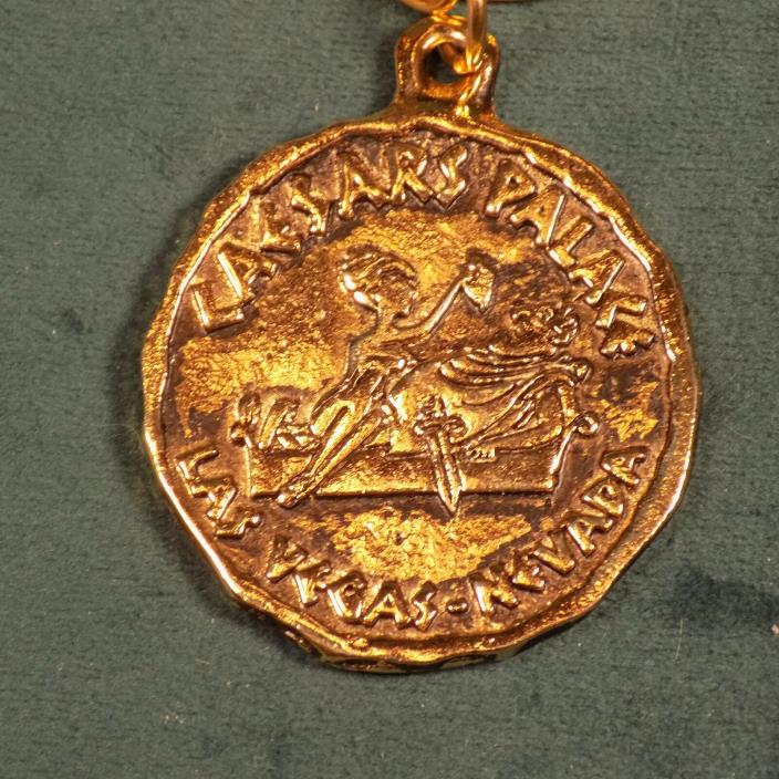 VINTAGE CAESARS PALACE COIN PENDANT WITH CHAIN LAS VEGAS NEVADA