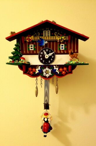 GERMAN BLACK FOREST CUCKOO CLOCK WHIMSICAL CHALET WITH BOUNCING LADY NEW!