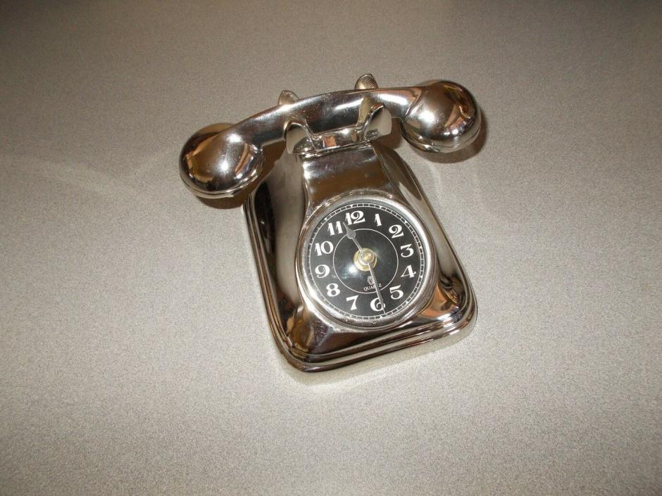 Polished cast metal vintage phone themed decorative quartz clock pre owned works