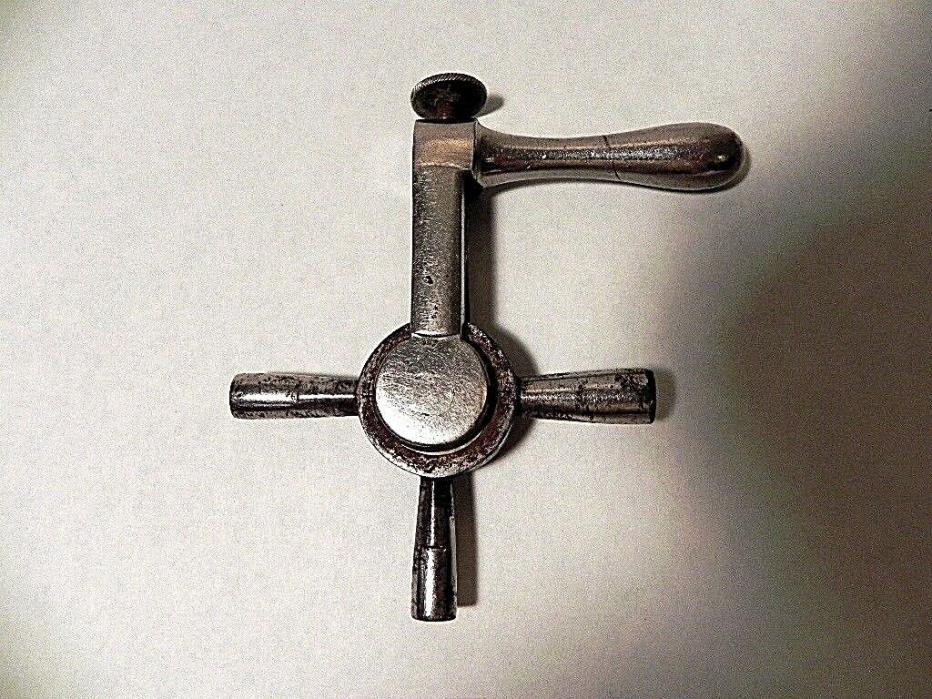 VINTAGE NICKEL PLATE ROTATING CLOCK KEY WITH LOCKING SCREW