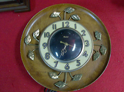 United Wall Clock Self Starting  United clock Co. Electric. Brown/gold