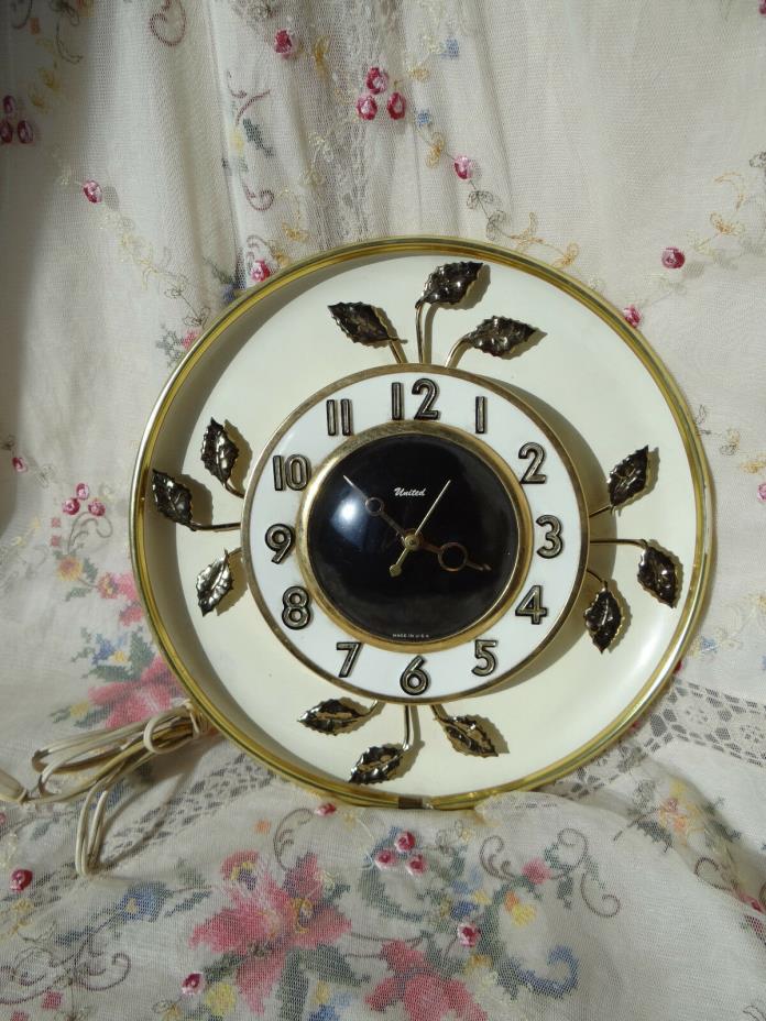 vintage retro United wall clock with metal gold leaf design electric