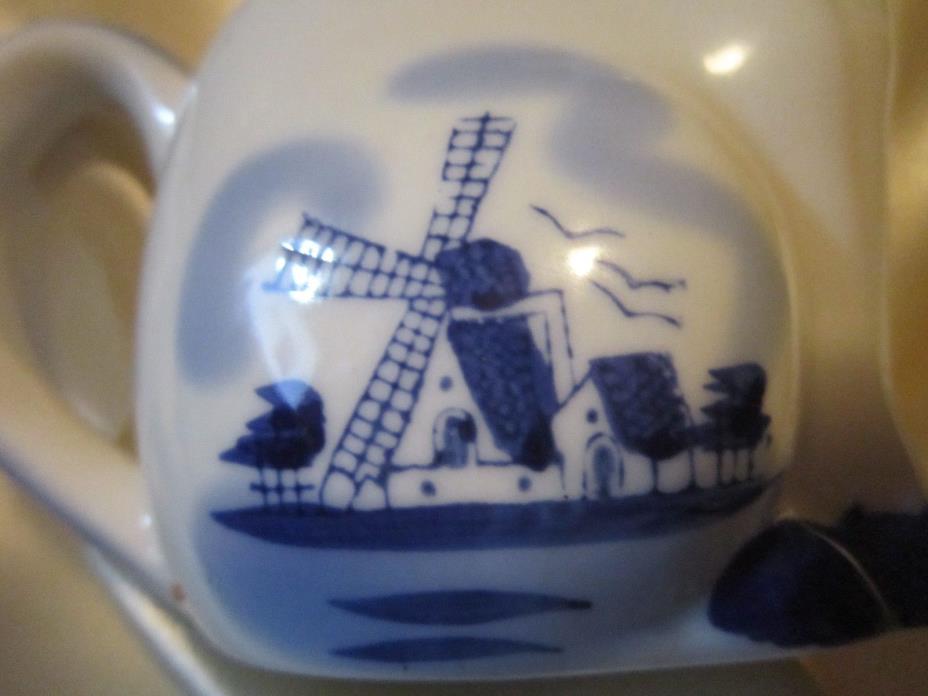 Cobalt Blue and White Windmill Sitting Cow Creamer