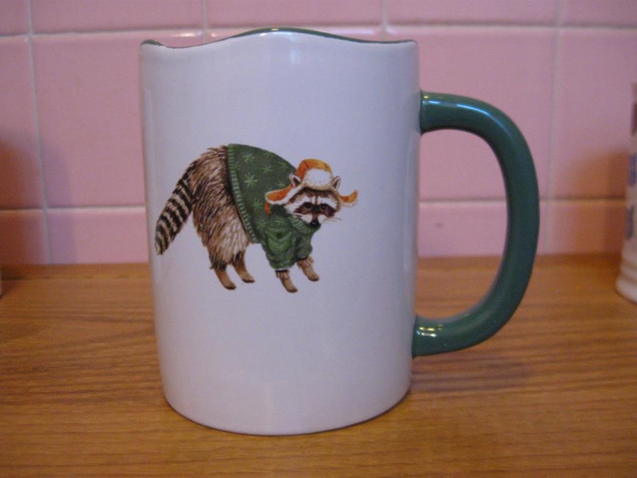 New Mug Raccoon Wearing A Sweater & Hat- Happy Holidays-  Angela Staehling Image