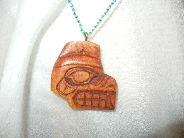 Hand carved wood beaver necklace pendant by Ralph Hill 1977 blue glass beads