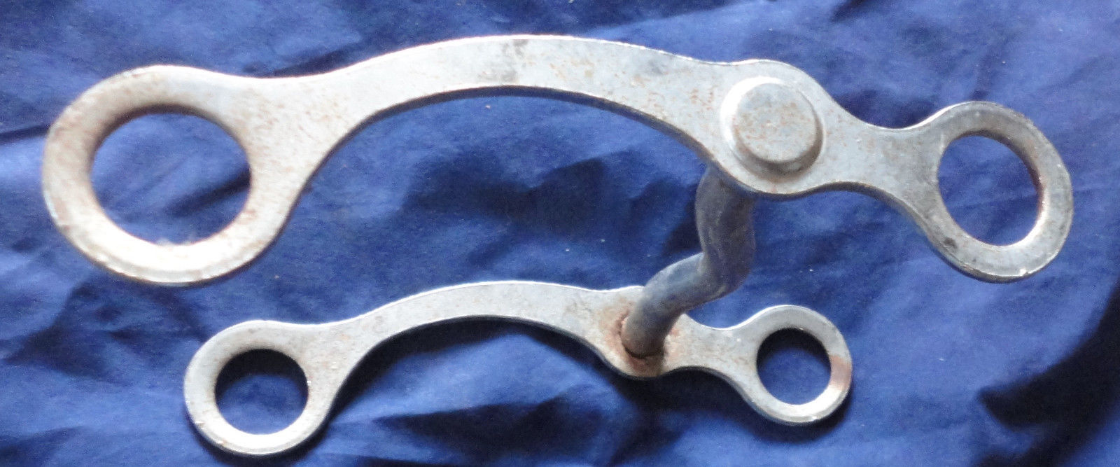An unmarked Vintage silver metal Horse bit