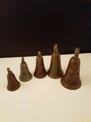 Five ornate engraved brass bells colored