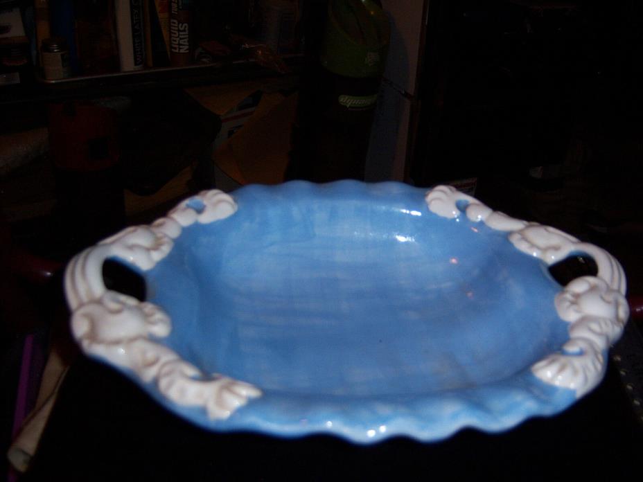 Ceramic blue and white bowl 11” long 4” of the length is the two handles. Handma