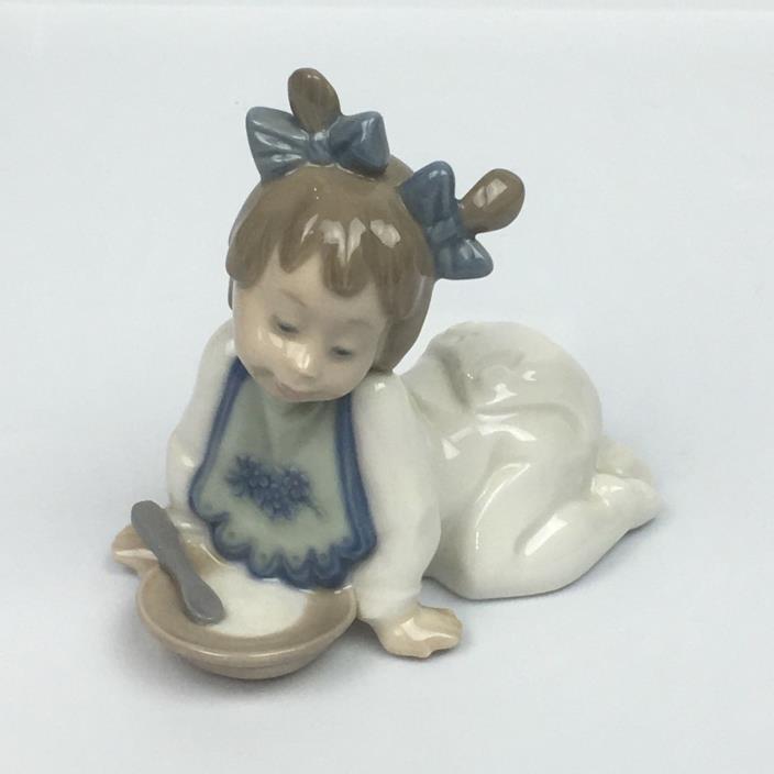 NAO FIGURINES BY LLADRO #01076 Baby Girl with Dish & Spoon