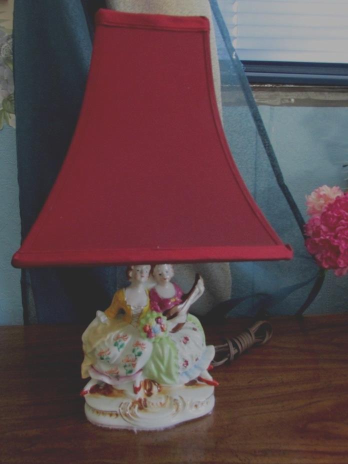 VINTAGE PORCELAIN BED SIDE LAMP, SHADE INCLUDED. TWO WOMEN IN COLONIAL STYLE CLO