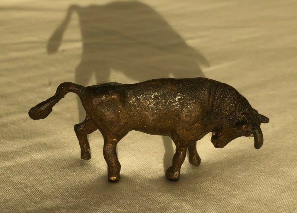 tiny miniature metal bull figurine - antique or vintage
