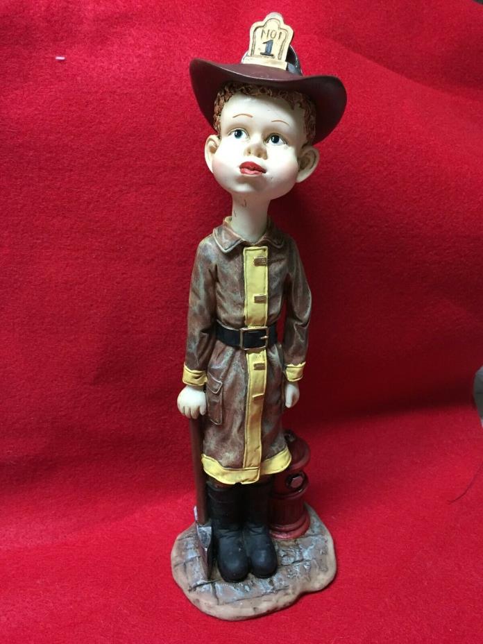 Boy dressed as fireman resin figurine-11