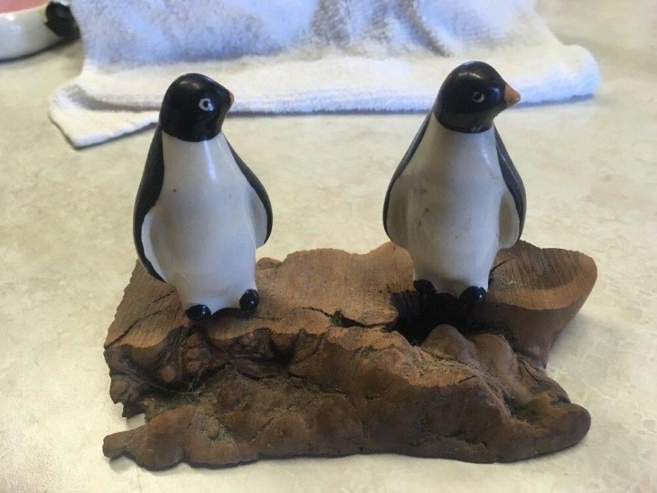 Penguins On A Rock