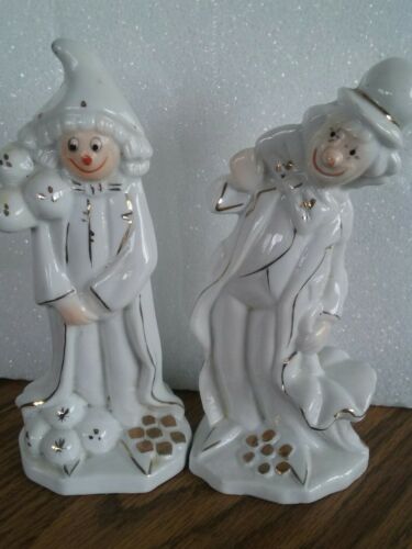 two porcelain clowns with gold trim