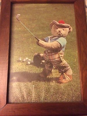 old picture of teddy bear golfing