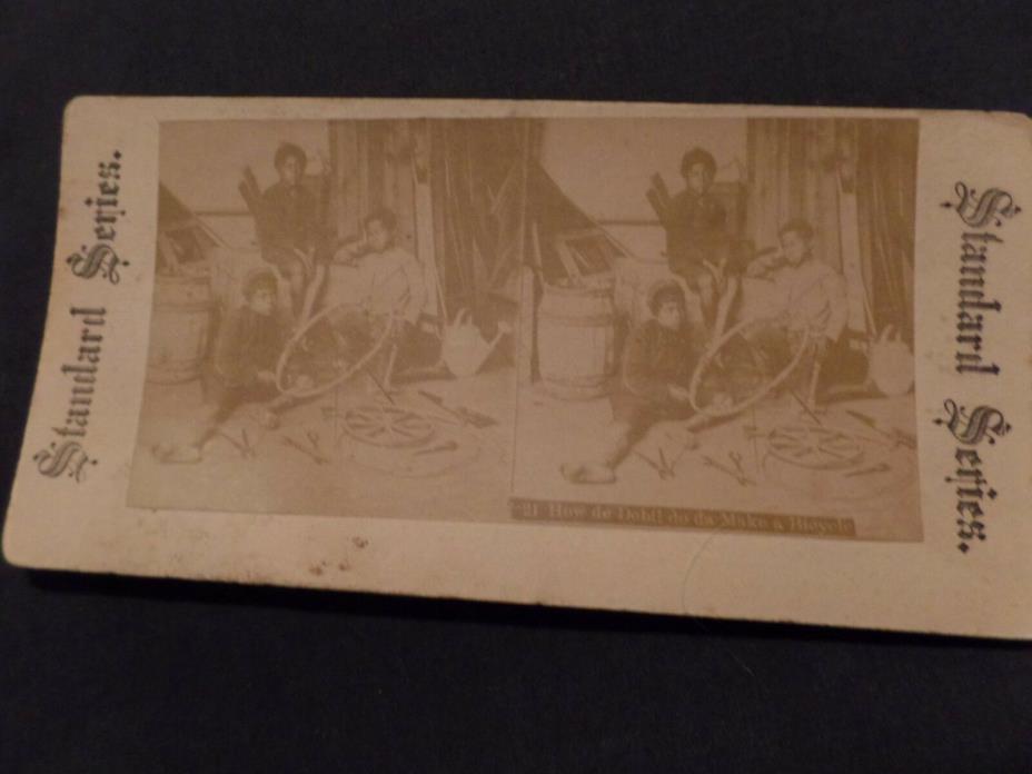 Stereoview card. Black Americana How de debil do da make a bicycle?