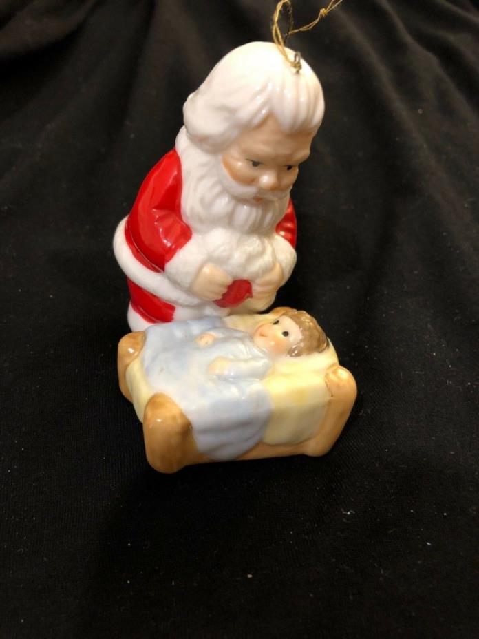 Vintage Christmas Ornament with Santa Bending Over baby Jesus, cute!