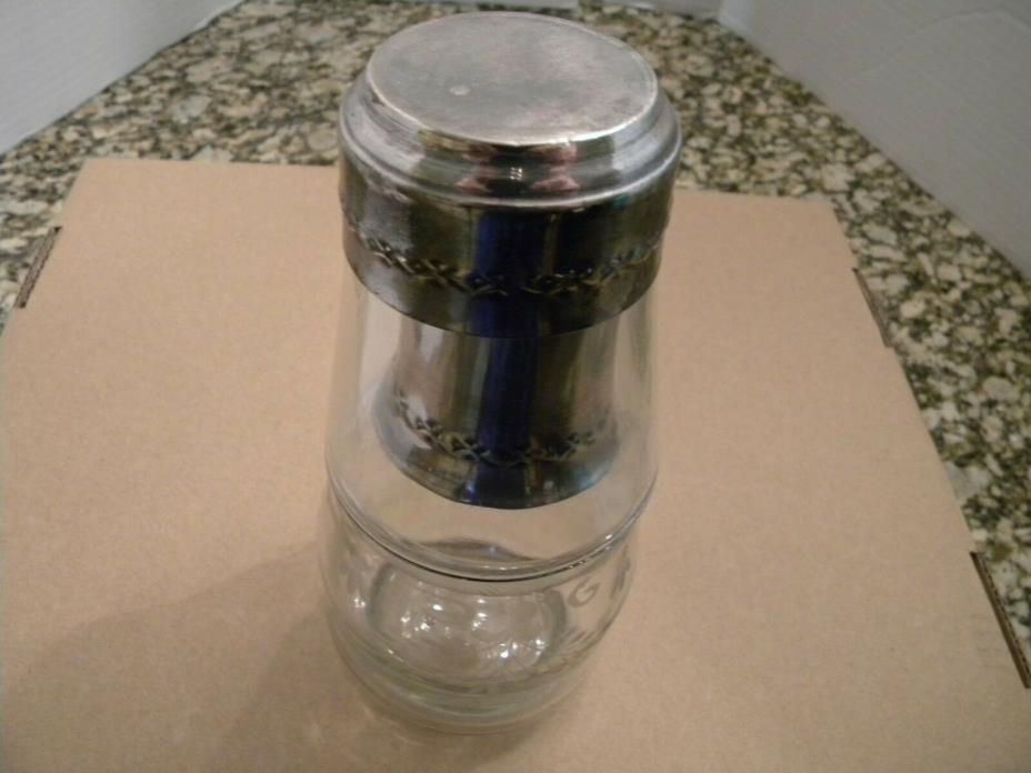 bed side  etched water  carafe and a glass, silver plate  trim around the rims.