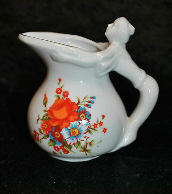 VINTAGE CERAMIC CREAM PITCHER WITH  FLOWERS & FIGURAL VICTORIAN WOMAN HANDLE