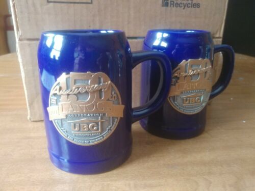 Set of 2 2005 UBC LANOGA CORP. 150TH ANNIVERSARY SINCE 1855, CERAMIC STEIN,