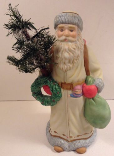 Porcelain Old World Santa Figurine - White Coat, Wreath, Tree and Bag of Toys