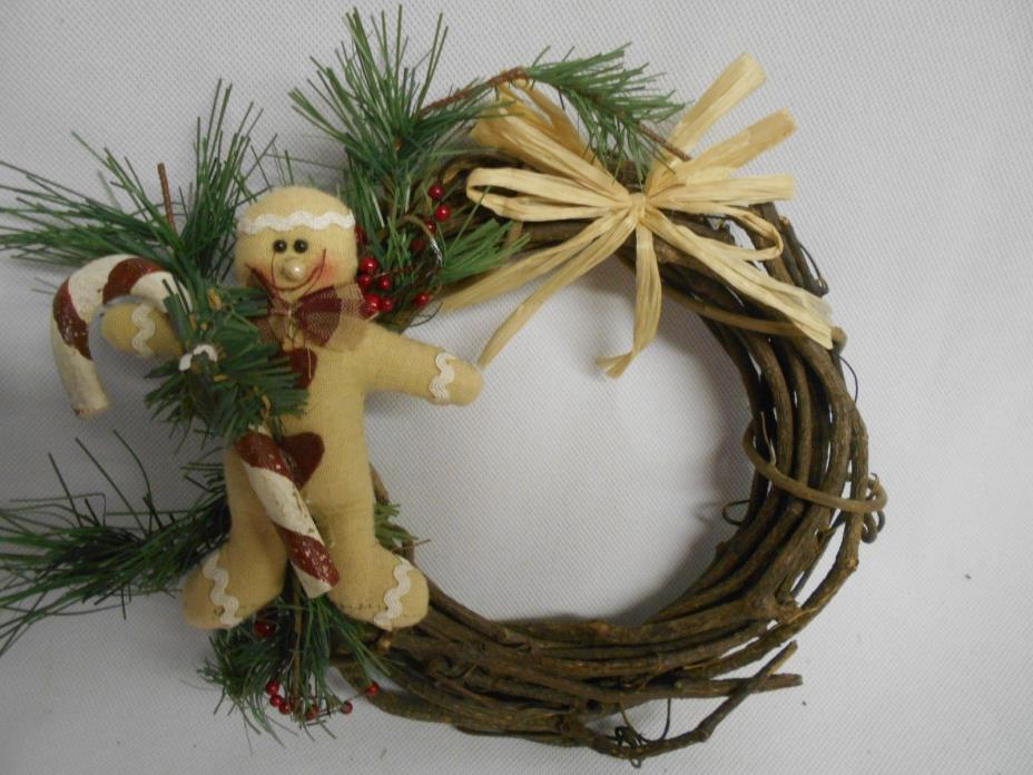 hand crafted Christmas wreath with gingerbread man and candy cane