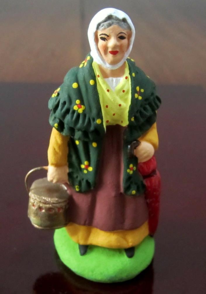 New Carbonel French Nativity santon #2 woman with a red umbrella and a heater