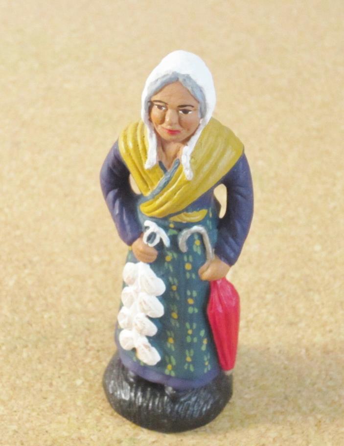Castelin-Peirano French Nativity santon #2 or #3 woman with garlic and umbrella