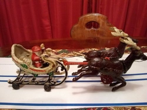 Antique Cast Iron Christmas SANTA CLAUS on Painted SLEIGH & REINDEER on Wheels
