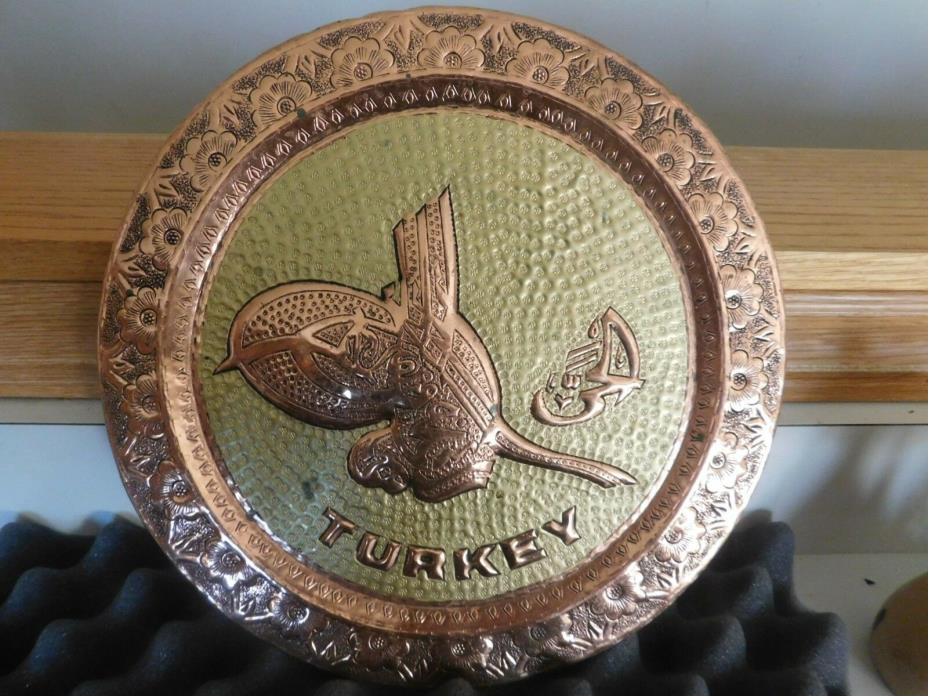 Copper and brass wall hanging Says Turkey on it round