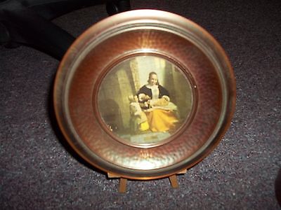 vintage copper like hammered metal plate wall hanging women in rocking chair bas
