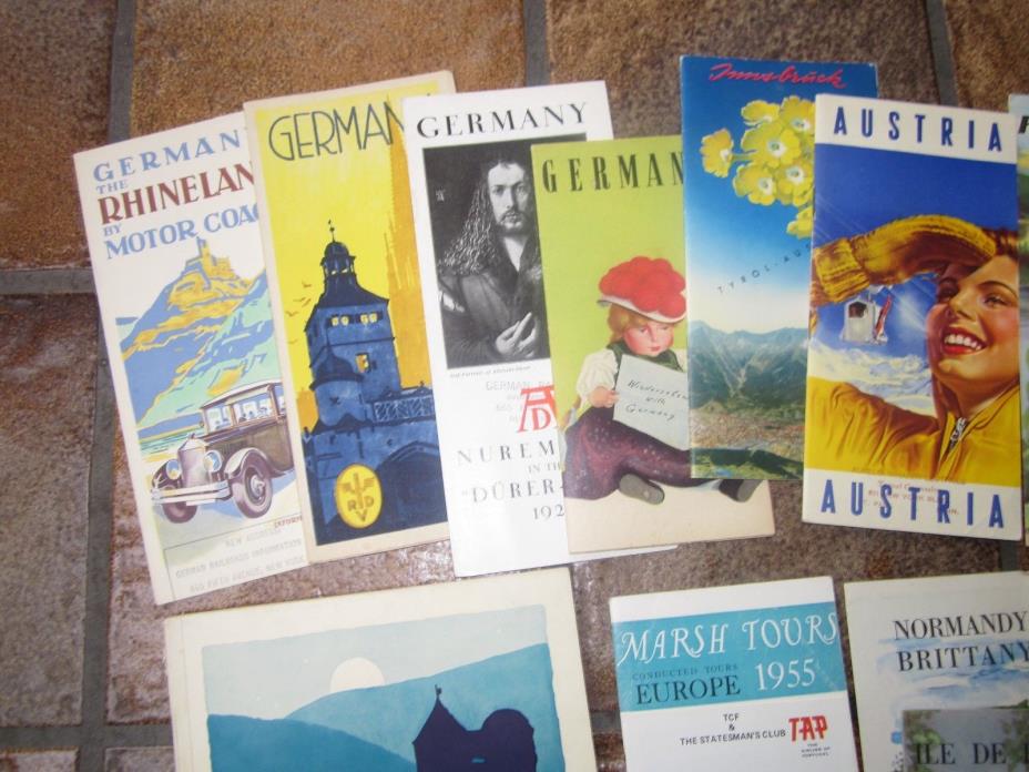 13 vintage European travel brochures.