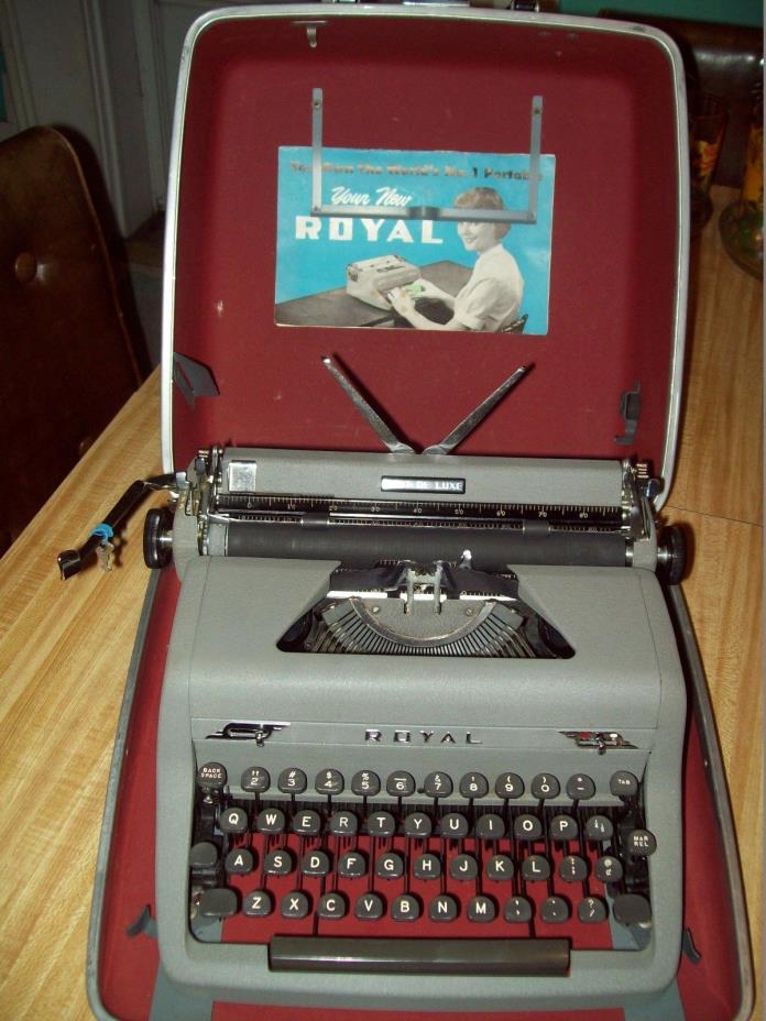 Vintage Royal Quiet Deluxe Typewriter in case with 1950 booklet and key