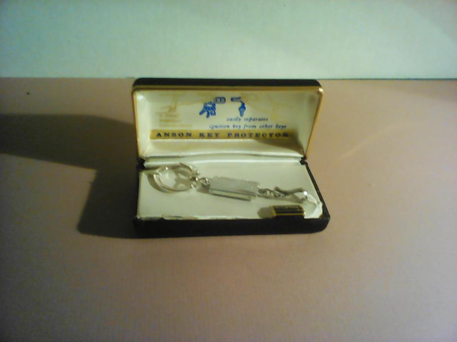 Vintage Anson key protector/chrome finish.  In snap closure case.