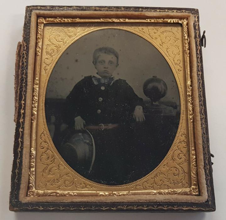 TINTED BRITISH AMBROTYPE OF BOY WITH GLOBE 1850s