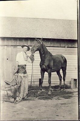 REAL COWBOY ABOUT TO SADDLE UP HIS HORSE circa 1910 RPPC Photo Postcard