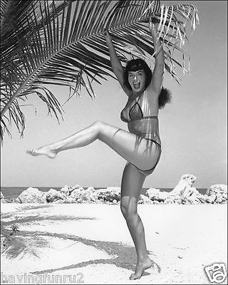 Bettie Page Hanging by Palm Branch On Beach 5 x 7  Photograph