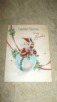VINTAGE CHRISTMAS GREETING CARD SANTA CLAUS w/ SADDLE & REINS RIDING WORLD GLOBE