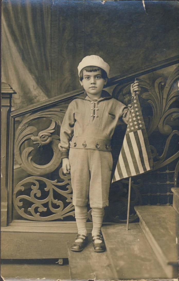 Little Boy in Naval Attire Holding U.S.48 Star Flag