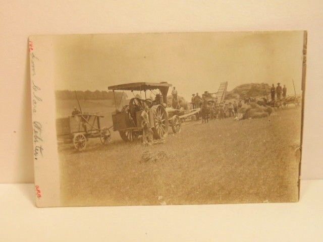 early postcard showing photo of farm scene with early equipment