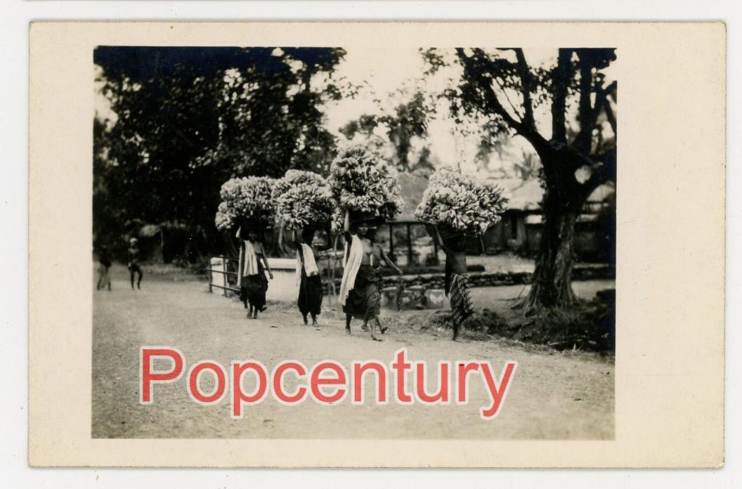 1930 RPPC Postcard Bali Indonesia Topless Women Carrying Bananas Real Photo