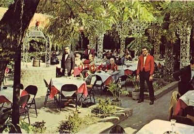 Waitstaff and customers dining COURT OF TWO SISTERS NEW ORLEANS, LA 1968