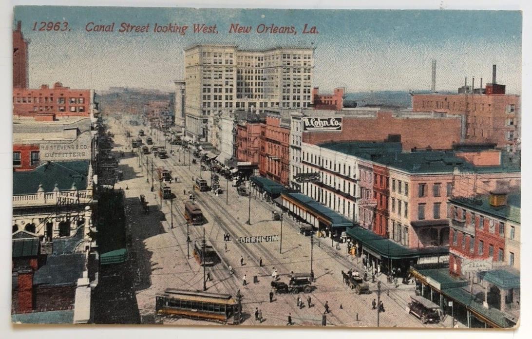 LA Postcard New Orleans Canal Street looking West streetcars trolleys stores