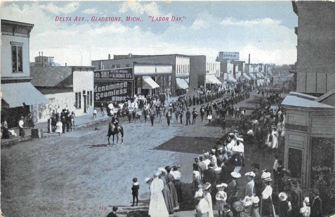 Gladstone Michigan c1910 Postcard Delta Avenue Labor Day Parade Shops Stores