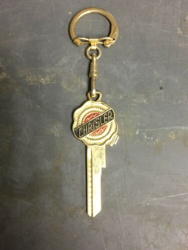 Vintage Designer Chrysler Key Blank And Key Chain Multi Colored W Chrysler Logo