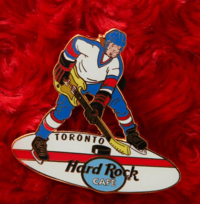Hard Rock Cafe Pin TORONTO Hockey Player Canada Guitar Stick Ice Skate rink puck