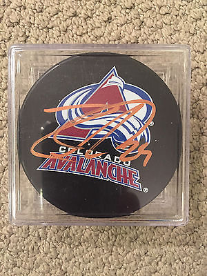 NATHAN MACKINNON COLORADO AVALANCHE SIGNED PUCK / COA